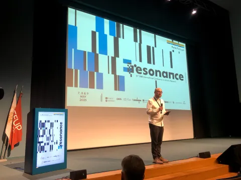Conference stage with speaker Paulo
