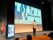 Conference stage with speaker Paulo